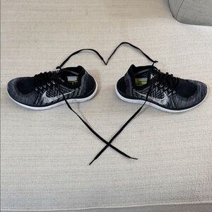 Women’s Nike Flyknit Black and Gray Sneakers